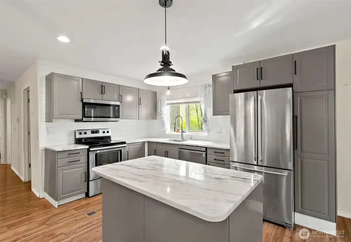 Kitchen with ample storage, sleek finishes, and functional layout