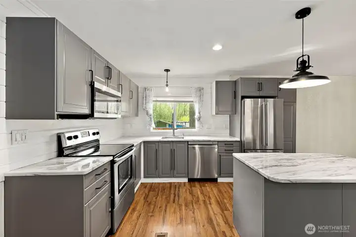 Stylish kitchen featuring stainless appliances and contemporary finishes