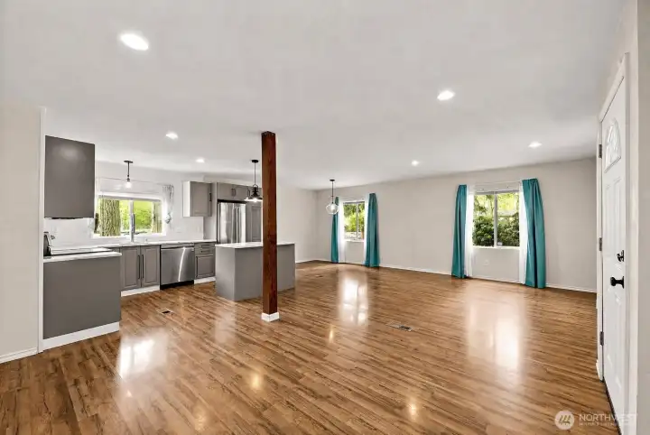 Wide open living area showcasing versatility and abundant natural light