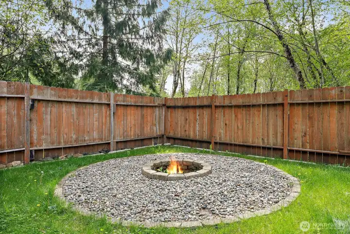 Close-up of fire pit seating area with gravel surround