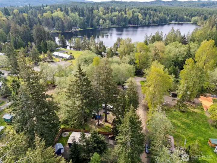 Aerial view of property and nearby lake setting