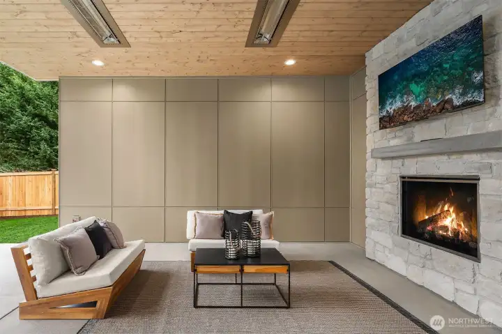Private outdoor covered living area with fireplace