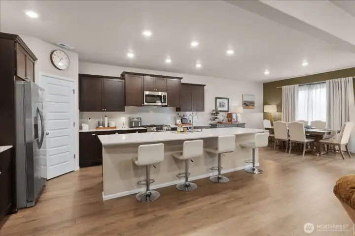 Large kitchen with oversized island and bar top seating. Large kitchen with oversized island and bar top seating.
