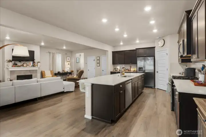 View of kitchen and living room from dining area. View of kitchen and living room from dining area.