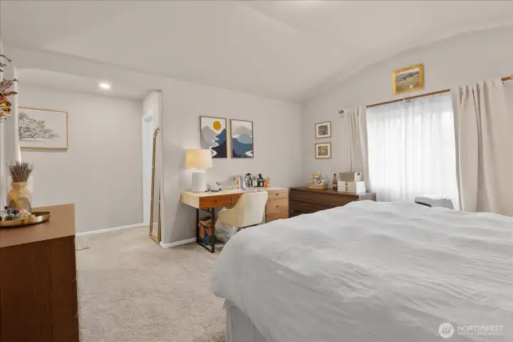 Primary bedroom with view of bathroom enterance. Primary bedroom with view of bathroom enterance.