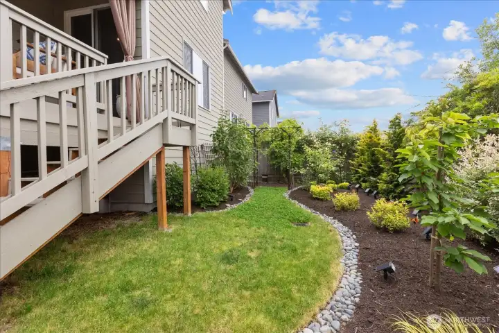 Backyard showing stairs leading to upper level deck. Backyard showing stairs leading to upper level deck.