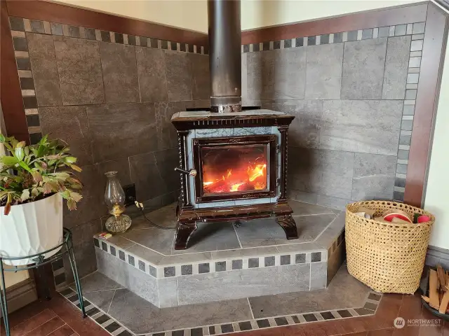 Notice the beautiful tile work surrounding the fireplace.
