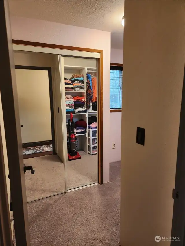 The first bedroom is being used as the seller's closet.