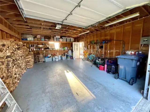 Garage is full of wood cut to fit the efficient wood stove. There is also another shed stuffed full of wood cut the size to fit the stove. Note that along with your car, your garbage and recycle bins also fit in the garage, no problem! At the end of the garage is a work shop area.