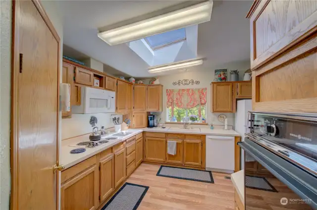 wall oven, lots of cabinets and counters