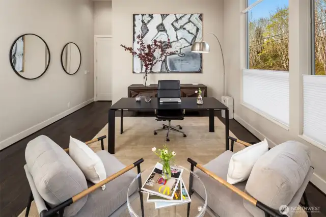 office is open to the main living level next to the kitchen.