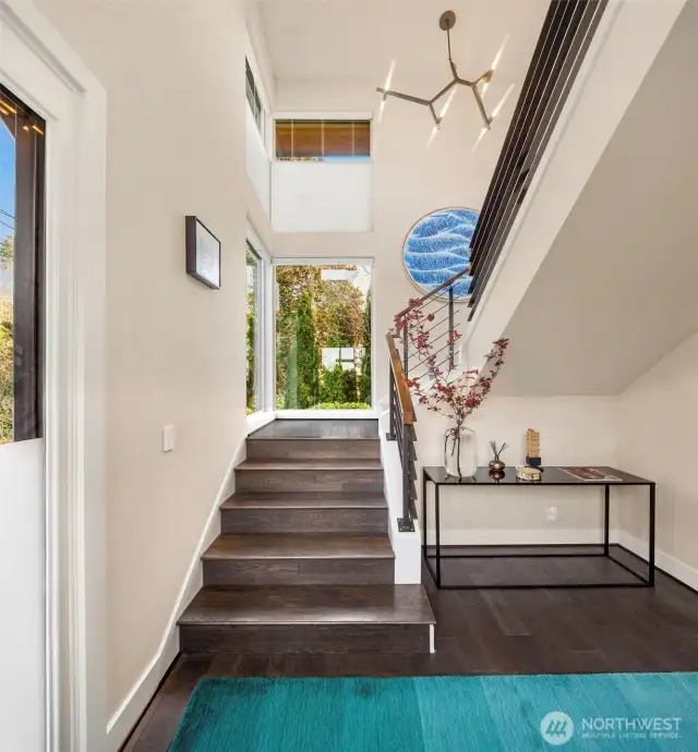 Architecturally dramatic entry. Or install an elevator and skip the stairs.