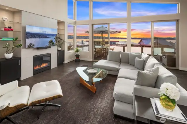 Gas fireplace in the indoor living room and easy access to outdoor living room and dining.