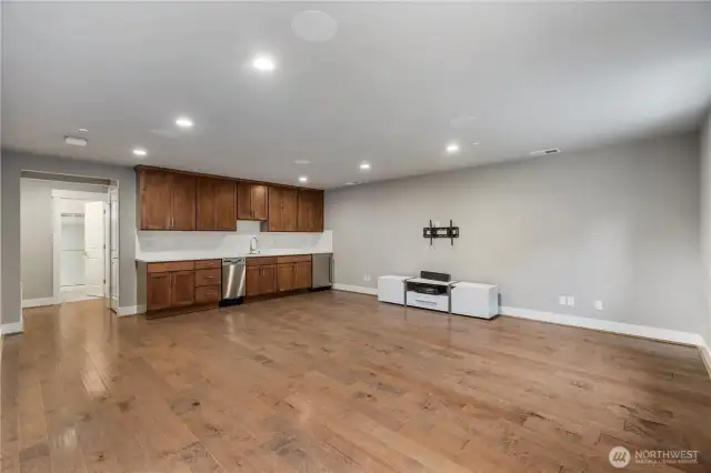 fully finished basement with wet bar and surround sound