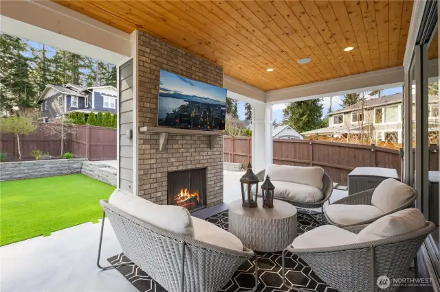 Covered patio with TV, Fireplace, and Built in speakers for music