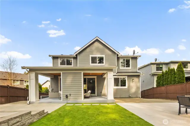 Fully landscaped yard with turf and pavers