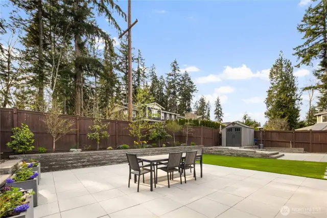 Fully landscaped yard with turf and pavers