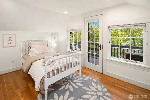 #3 bedroom on upper level with access to upper deck above the front porch. A magical spot. Also has ductless A/C.
