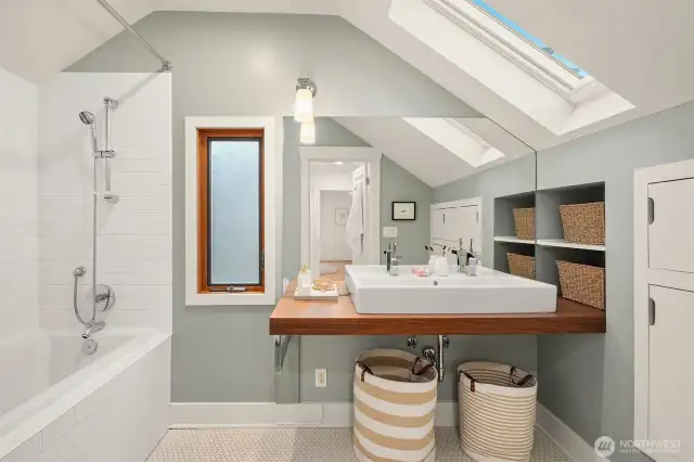 Full bathroom with radiant floor heat on upper level with two beautiful skylights. Good storage.