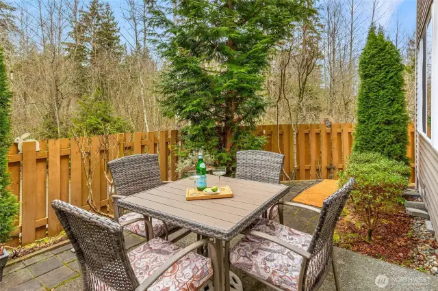 A beautifully private backyard looks onto a greenbelt.