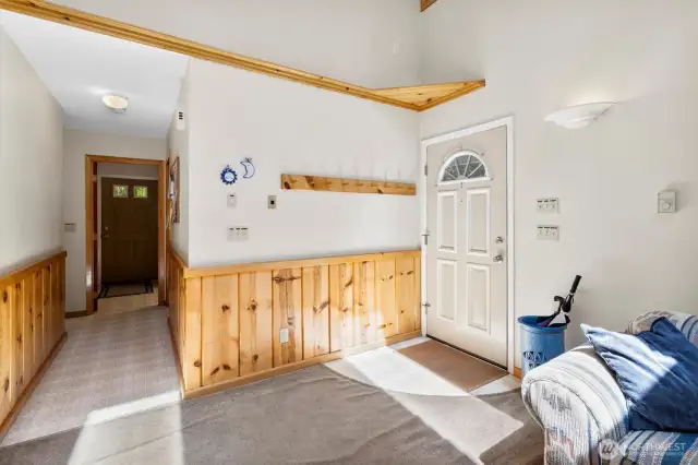 Front entrance & hallway to 3/4 bath, launrdy room + main floor bedroom