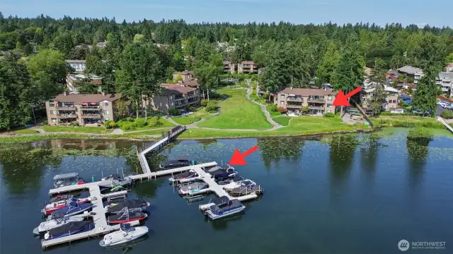 View of unit from the lake side along with deeded boat slip noted with an arrow