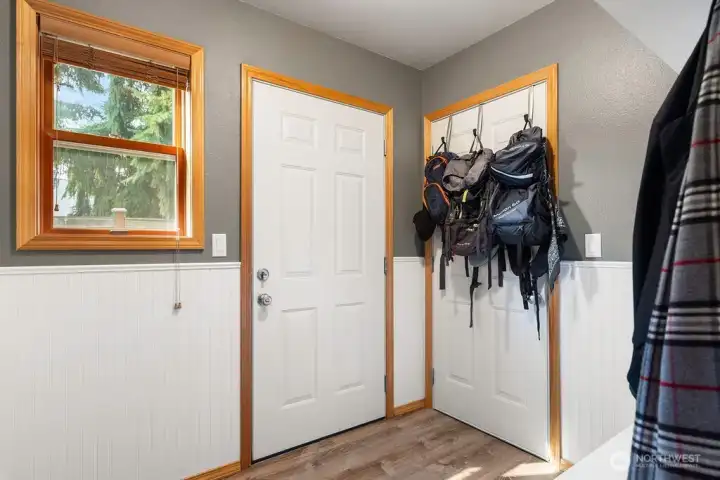 Mud room with bench and hanging hooks