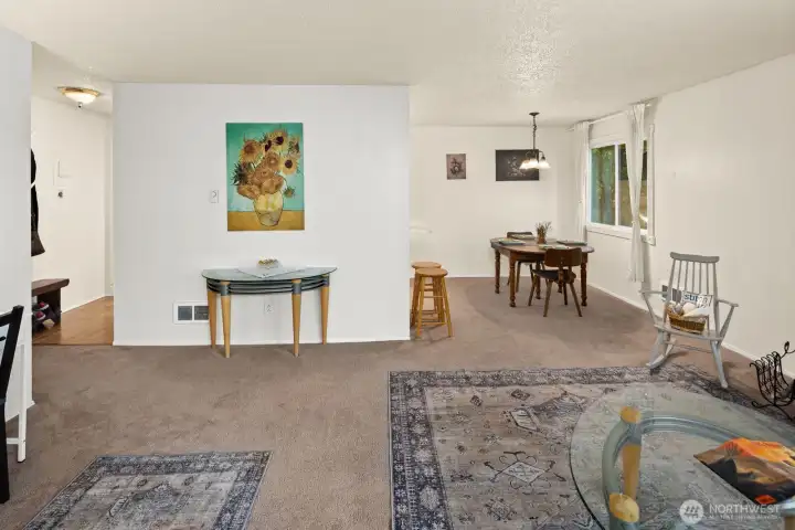 The dining room opens into a large open living room space.
