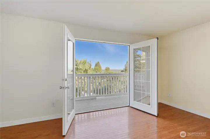 Primary bedroom with french doors to deck #2