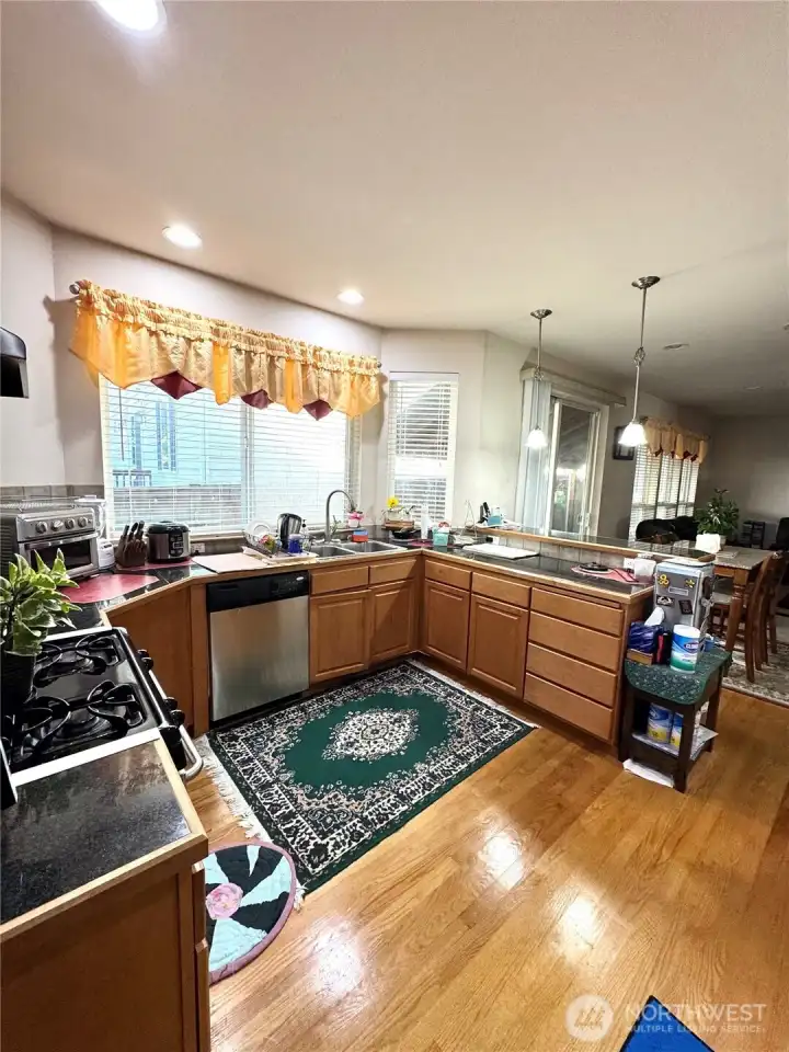 Kitchen with Granite and Stainless steel Appliance