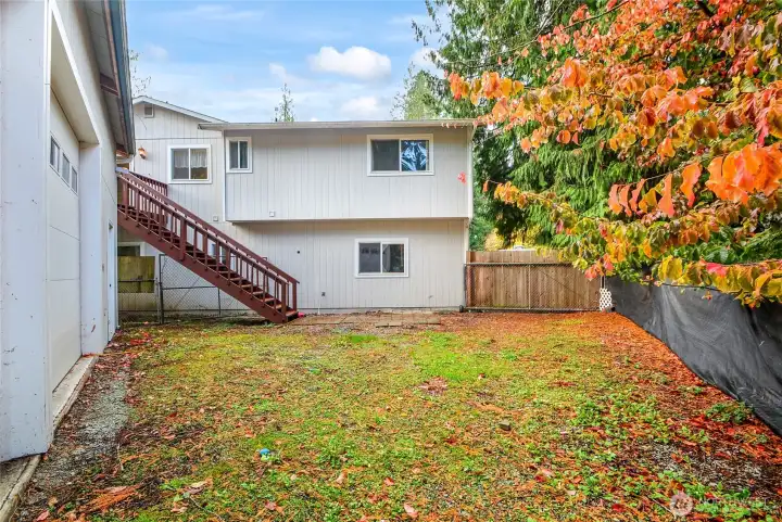 Back area with huge shop and a shed
