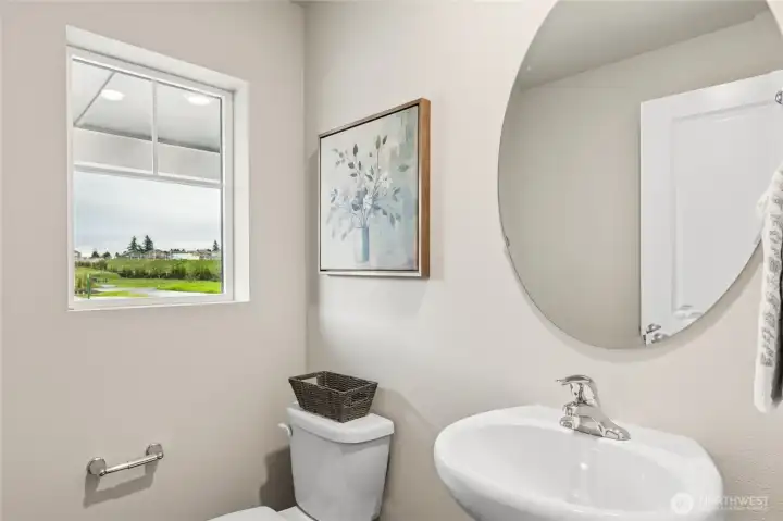 Main floor powder room. Photo is representational. Actual home is under construction. Colors, materials, and features may vary. See site agent for details.