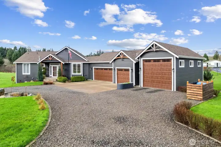 3 car- Deep bay garage offering exceptional storage capacity+ RV garage!