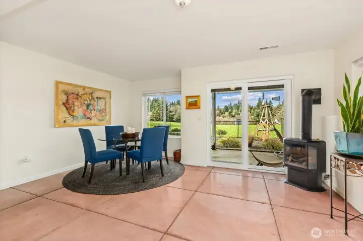 Daylight basement opens up to the fenced space for pets or an evening relaxing by the fire