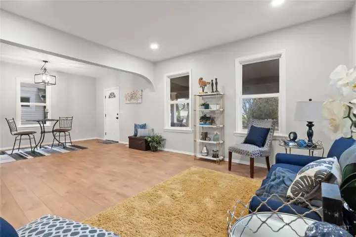 Enter into this lovely remodeled home with Living & Dining Rooms w/New Laminate Flooring. Vinyl Windows, High Ceilings, New Lighting.