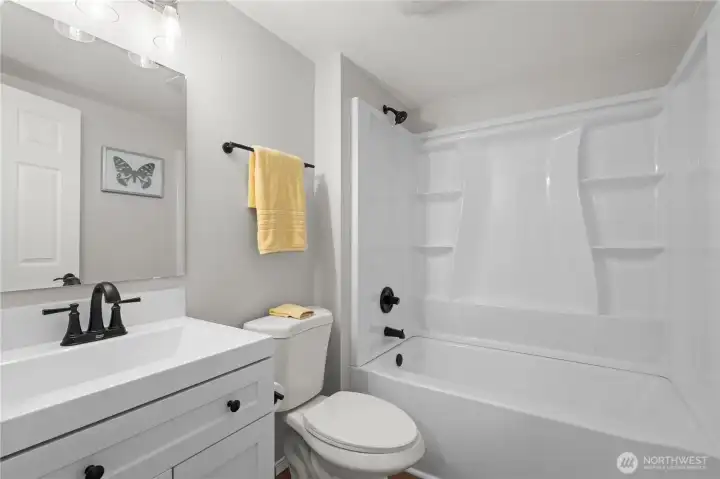 Primary Full Bath: New Vanity, Plumbing & Fixtures, Tub/Shower Surround, Toilet, Laminate Flooring.