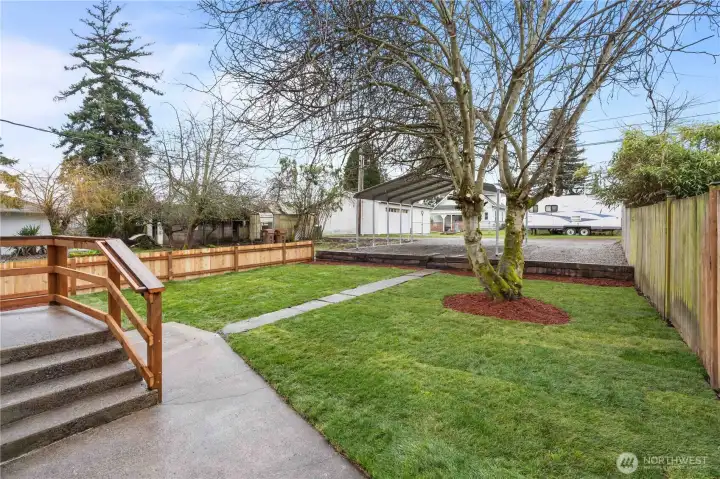 Spacious Backyard w/Designated Parking area for 3 Vehicles. Railroad Ties create a smooth transition between the lawn and parking.