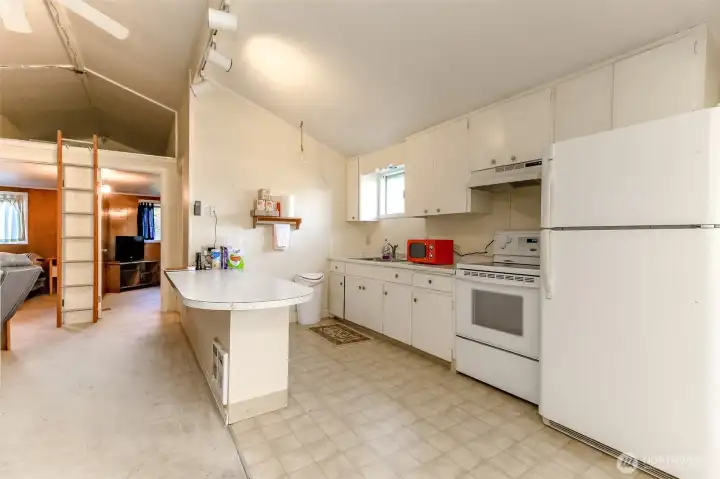 Kitchen with plenty of room and access to the loft area between he 2 bedrooms
