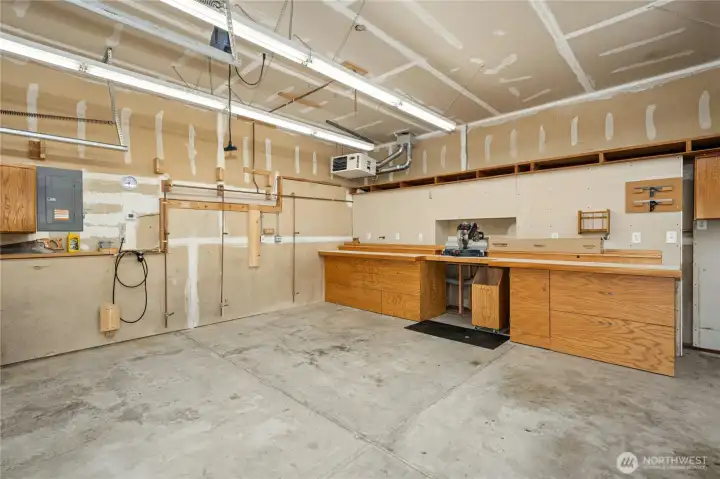 3 car garage has work bench and heater