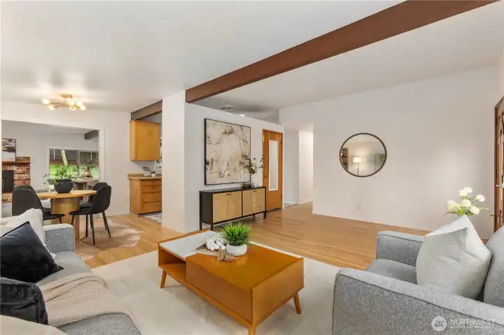 The entry level living area flows into the kitchen & dining space, with views into the second living and dining space beyond