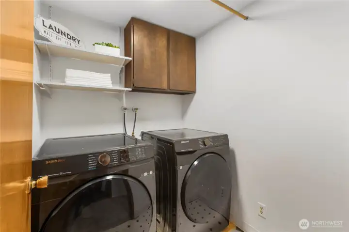 The separate laundry room provides convenient storage and can easily be reconfigured to stack the washer/dryer for even more space