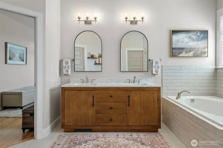 All new  - vanity, mirrors, lighting, tile surround for both tub and shower, and new shower glass!