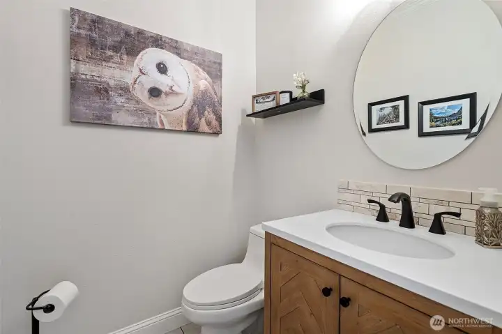 Off of the entry/kitchen you'll find this powder room.