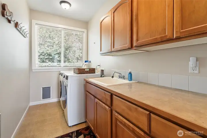 Behind the kitchen is the spacious laundry.