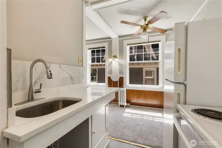 Stunning updated kitchen with new white slab quartz countertops,new ss undermount sink,new goose neck faucet and new matching tile back splash to enjoy at your next home.  There is also new appliances that stay with the home as well.