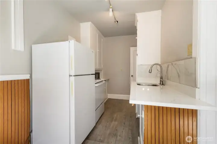 View of new updated kitchen with new paint flooring appliances and fixtures to make cooking enjoyable