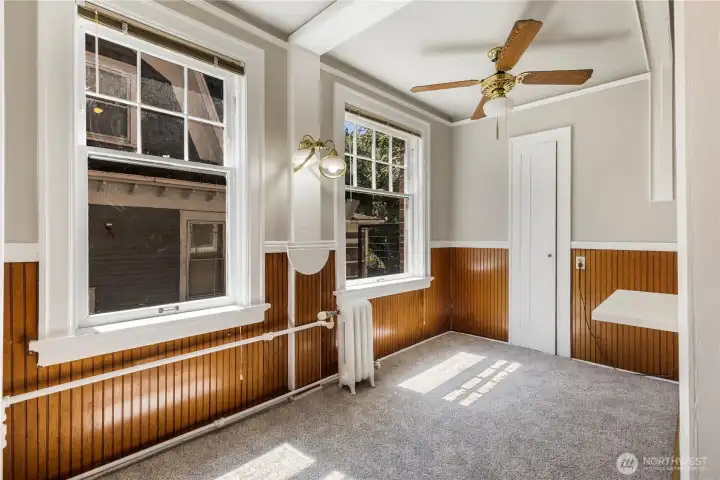 Second view of eat in kitchen area big enough for all your gatherings.  There is lots of new white painted millwork to brighten up all rooms and window sills