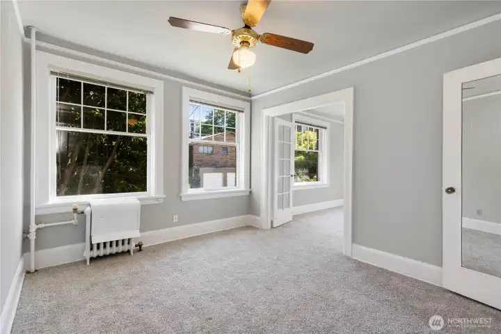 Bedroom view again with warm water heated radiators covered in your HOA dues.  Check out the new plush soft carpeting just put in matching interior colors