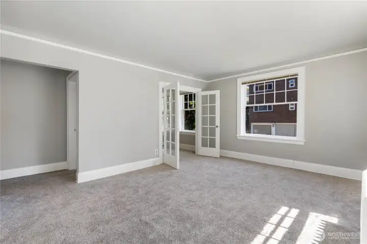 Family room view as you enter from front door hallway.  This is a big room on only 2nd floor with views on two sides of exterior of building and city landscapes out your windows