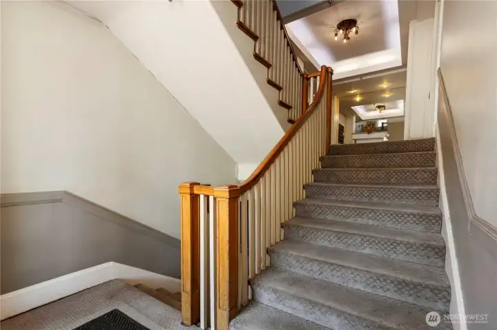 Here are beautiful entrance stairs leading up to lobby and unit 202 to left of lobby and end unit